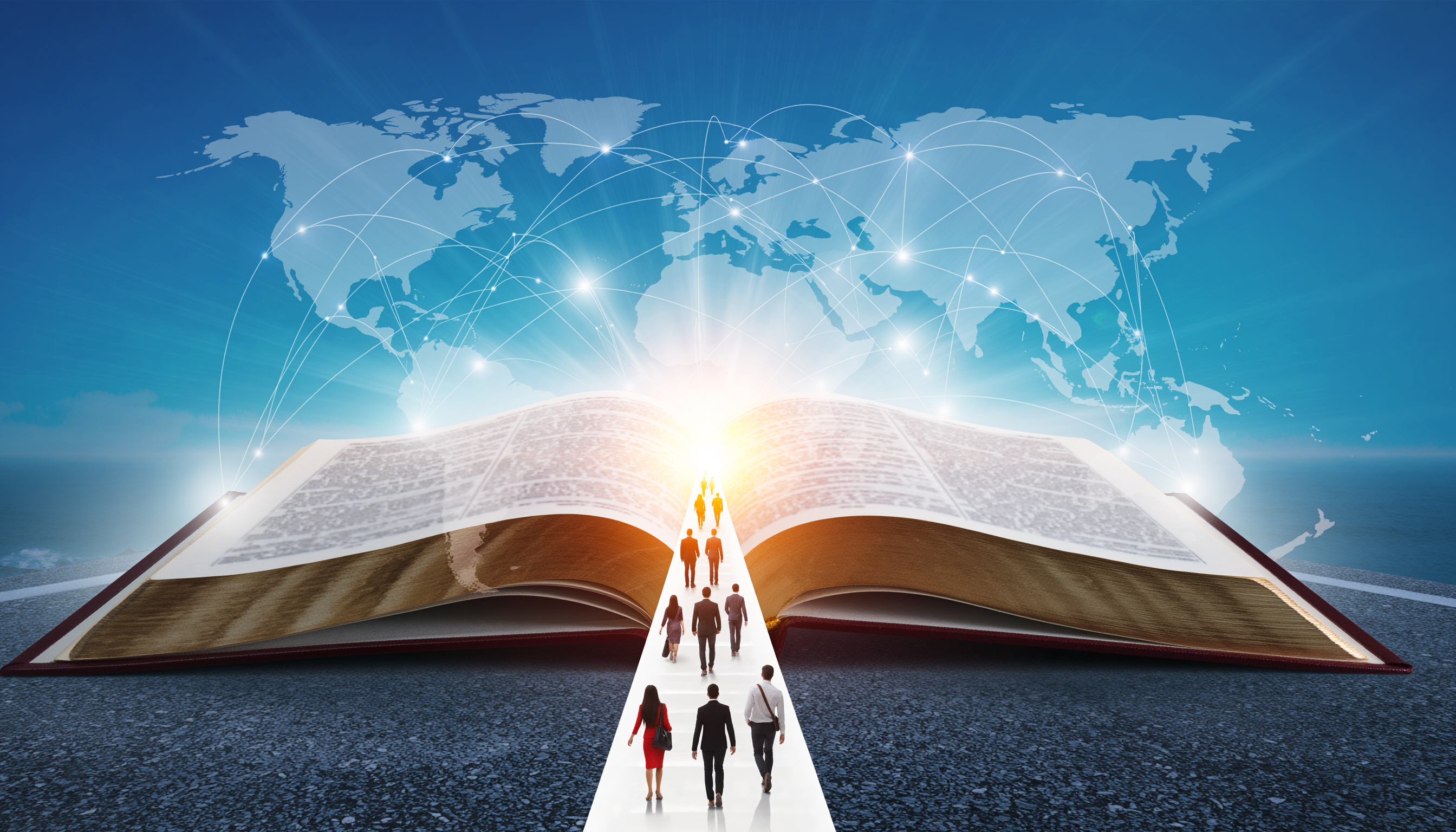 Open Bible with global mission map — people walking toward the light